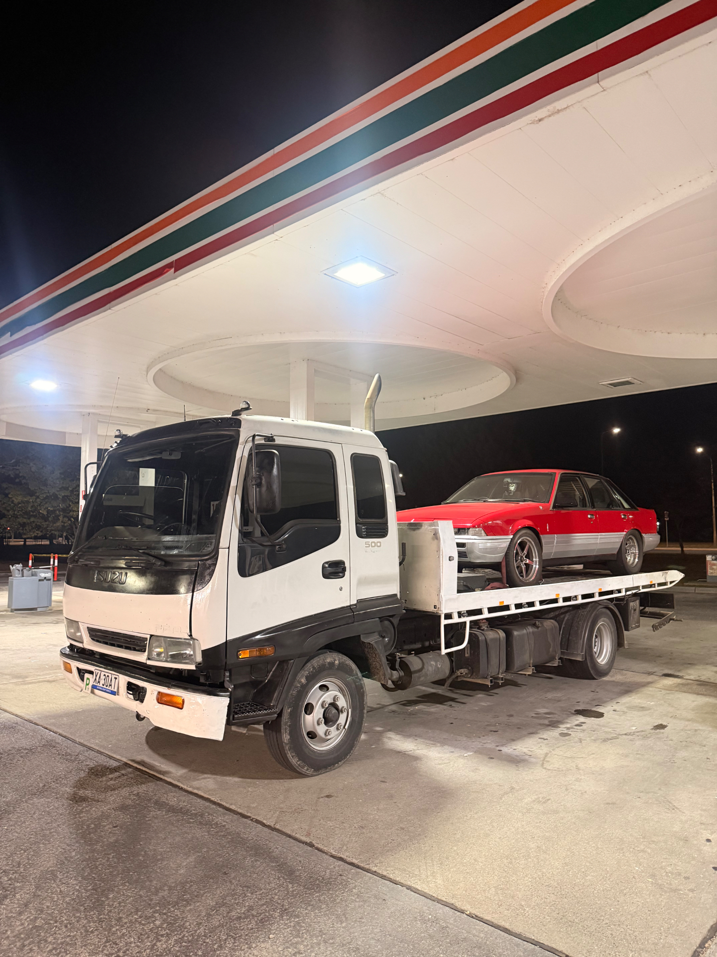HM Towing flatbed tow truck at night in Canberra